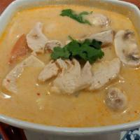 Tom Kha · Tart and spicy soup with galanga, lemongrass, mushrooms, tomato, coconut milk & chili paste.