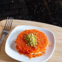 Knafeh · Shredded katafie dough filled with soft white cheese, topped with rose water syrup and chopp...