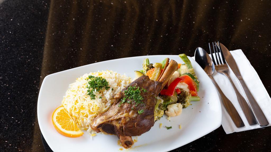 Lamb Shank Lunch · Gluten-free, halal. Tender lamb shank braised with middle-eastern spices. Served with basmati rice and sautéed vegetables.
