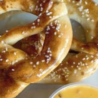 Homemade Soft Pretzels · Hefeweizen beer dough pretzels served with IPA spicy mustard and house queso.