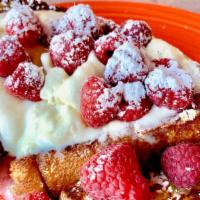 Raspberry Ricotta French Toast · Fresh raspberries, with a vanilla, honey and orange zest infused whipped cream.