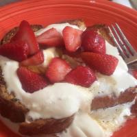 Creme Brulee French Toast · Our thick French toast with whipped cream and fresh strawberries, topped with our crème brûl...