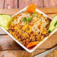 Goat Biryani · Contains nuts. Tender pieces of goat cooked with Indian spice-infused basmati rice, nuts, ra...