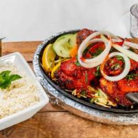 Tandoori Whole Chicken · Chicken marinated in tandoori masala and yogurt for 24 hours, then barbecued to perfection i...