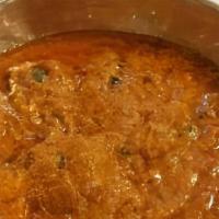 Roganjosh · gravy filled with garlic , ginger and aromatic spices