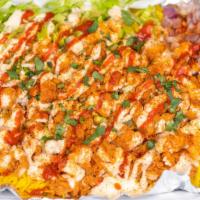 Crispy Chicken Over Rice · Rice dishes are served with your choice of meat lettuce grilled onions ranch sriracha and a ...