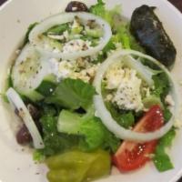Greek Salad · Romaine lettuce topped with feta cheese, tomatoes, cucumbers, pepperoncini, onions, dolmades...