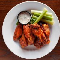 Famous Fiery Buffalo Wings · Made in House sauces, celery, chunky blue cheese or smoked tomato ranch dressing.