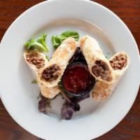 Cheesesteak Spring Rolls · Served with Sriracha ketchup on side.