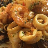 Seafood Linguini · Diver scallop, large shrimp, calamari, pei mussels in creamy tomato sauce.