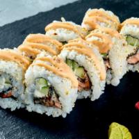 Crunch Dynamite · Spicy tuna rolled in crunch, topped with avocado, colorful caviar, and served with ponzu sau...