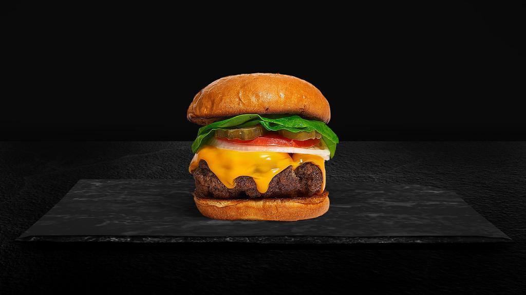 House Cheeseburger · American beef patty (1/2 lb.) topped with lettuce, melted cheese, tomato and pickles.
