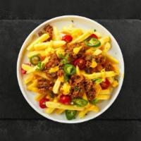 Loaded Fries · Idaho potato fries cooked until golden brown and garnished with ground beef, chili, cheddar ...
