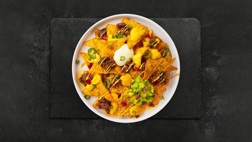 Loaded Nachos · Salted tortilla chips doused in chili, cheese, seasoned ground beef, black olives, tomato, onion, salsa, and sour cream.