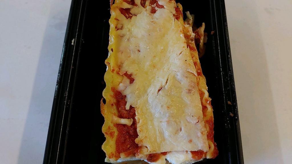 Lasagna · Layers Of Ground Beef, Ricotta Cheese, Mozzarella Cheese, Tomato sauce