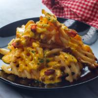 Buffalo Chicken Cheesy Waffle Fries · Perfectly prepared fried waffle fries, topped with salt, Buffalo chicken and melted smoked p...