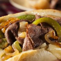 Classic Philly Cheesesteak Sandwich · Perfectly toasted Italian bread, choice of marinated beef or chicken steak, sautéed red onio...