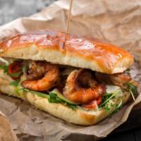 Signature Surf & Turf Cheesesteak Sandwich · Perfectly toasted Italian bread, marinated jumbo grilled shrimp, chicken steak, sautéed red ...