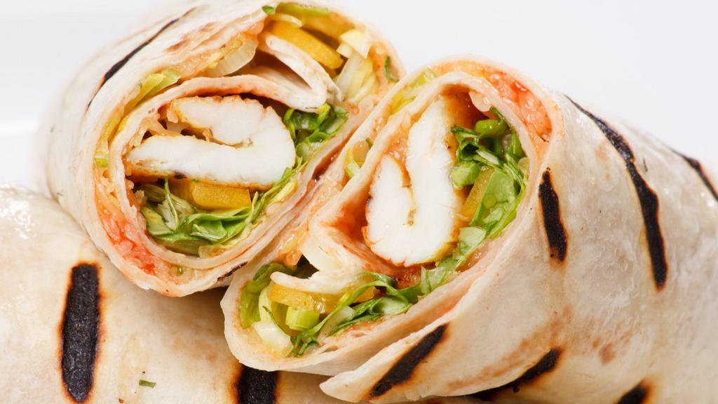 Surf 'N' Turf Wrap · Perfectly prepared wrap with spicy tartar, marinated grilled chicken & shrimp, Cajun rice, red bean, red onion, roasted green & red bell pepper, grape tomato, baby arugula, lemon drizzle diced tomato with cilantro mix baby corn, chipotle sauce, avocado, sour cream & shredded cheese.
