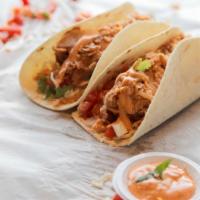 Chipotle Chicken Wrap · Perfectly prepared wrap with chipotle sauce, marinated grilled chicken, Cajun rice, red bean...