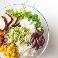 Chipotle Chicken Bowl · Perfectly prepared bowl with chipotle sauce, marinated grilled chicken, Cajun rice, red bean...