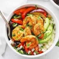 Surf & Turf Bowl · Perfectly prepared bowl with spicy tartar, marinated grilled chicken & shrimp, Cajun rice, r...