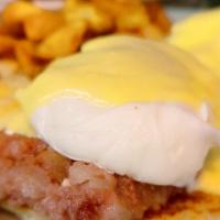 Eggs Irish Benedict · Two dropped eggs on a grilled English muffin and Corned beef hash, then draped with hollanda...