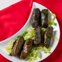 Stuffed Grape Leaves · 6 pieces, Rolled with Rice,  Herbs, Lemon Juice.
