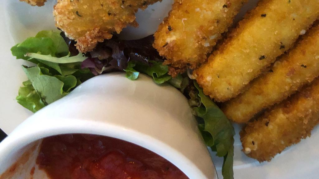 Fried Mozzarella · Panko battered mozzarella wedges made in house, fried to golden brown; served with our homemade marinara.