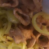 Calamari · Fried squid rings tossed with banana peppers in a white wine, butter and garlic sauce. Add  ...