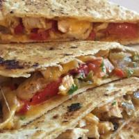 Chicken Quesadilla · A tortilla shell stuffed with grilled chicken, cheddar cheese, tomatoes, peppers and onions,...