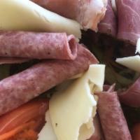 Antipasto Salad · Antipasto salad sliced italian cold cuts, provolone cheese; served over our house salad with...