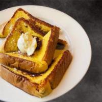 French Toast · Topped with cinnamon and served with butter and syrup.