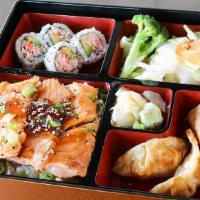 Salmon Bento · Served with mixed vegetables. 4 pcs california rolls, 2 pcs chicken dumplings, and 2 pcs spr...