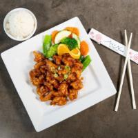 Orange Chicken · Crispy fried sliced white meat chicken covered in sweet spices orange sauce. Served with whi...