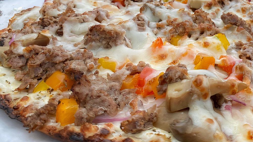 Philly Cheesesteak Pizza · Philadelphia cream cheese, mushrooms, green peppers, onions, mild pepper rings and steak.