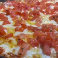 Tomato Pie Pizza · Starts with special garlic butter base fresh tomatoes and basil our house seasoning and a th...