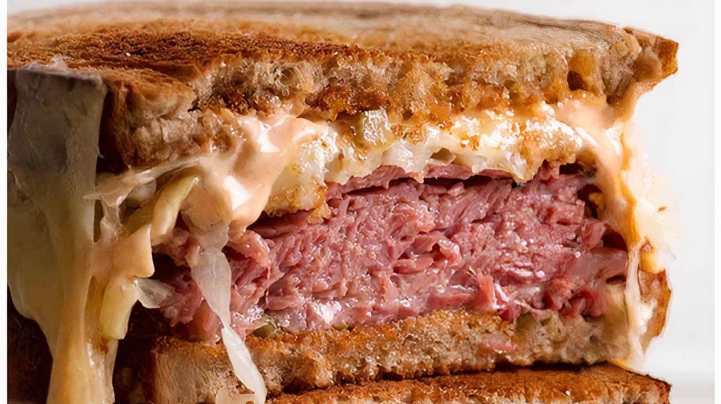 Reuben Sandwich · Thin sliced corn beef, sauerkraut, Thousand island, and cheese served on rye bread.