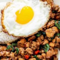Pad Kha Phao · Spicy Ground Meat with Onion, Bell Peppers, Holy Basil, Topped with an Egg.