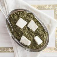 Saag Paneer · Spinach cooked with homemade cheese cubes and herbs. Vegetarian.