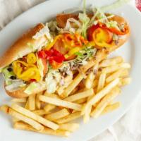 Philly Cheesesteak · Chopped ribeye steak and Provolone cheese, loaded with lettuce, tomato. onions, banana peppe...