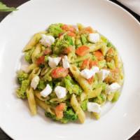 Penne Broccoli · Penne pasta, broccoli, tomatoes, garlic, pesto sauce, fresh mozzarella.