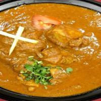 Chicken Curry · Boneless chicken cooked with herbs and spices.