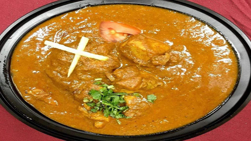 Chicken Curry · Boneless chicken cooked with herbs and spices.