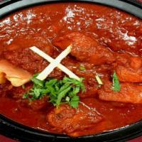 Chicken Vindaloo · Tender Pieces of chicken and potatoes cooked in hot spicy sauce with dash of lemon.