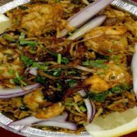 Shrimp Biryani · Basmati rice cooked with marinated shrimp, herbs and spices.