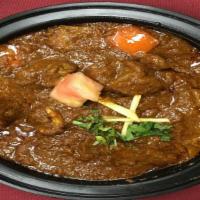 Goat Masala · Fresh goat cooked with tomatoes, onions & spices.