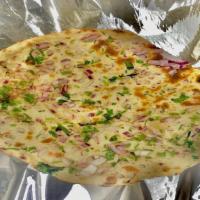Onion Kulcha · White flour bread stuffed with onions, coriander and mild spices baked in tandoor clay oven.