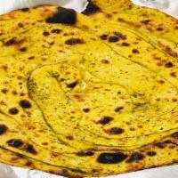 Pudina Paratha · Whole wheat bread sprinkled with mint leaves and baked in tandoor clay oven.