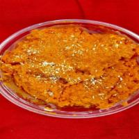 Gajar Ka Halwa · Grated carrots cooked in ghee, raisins and nut.